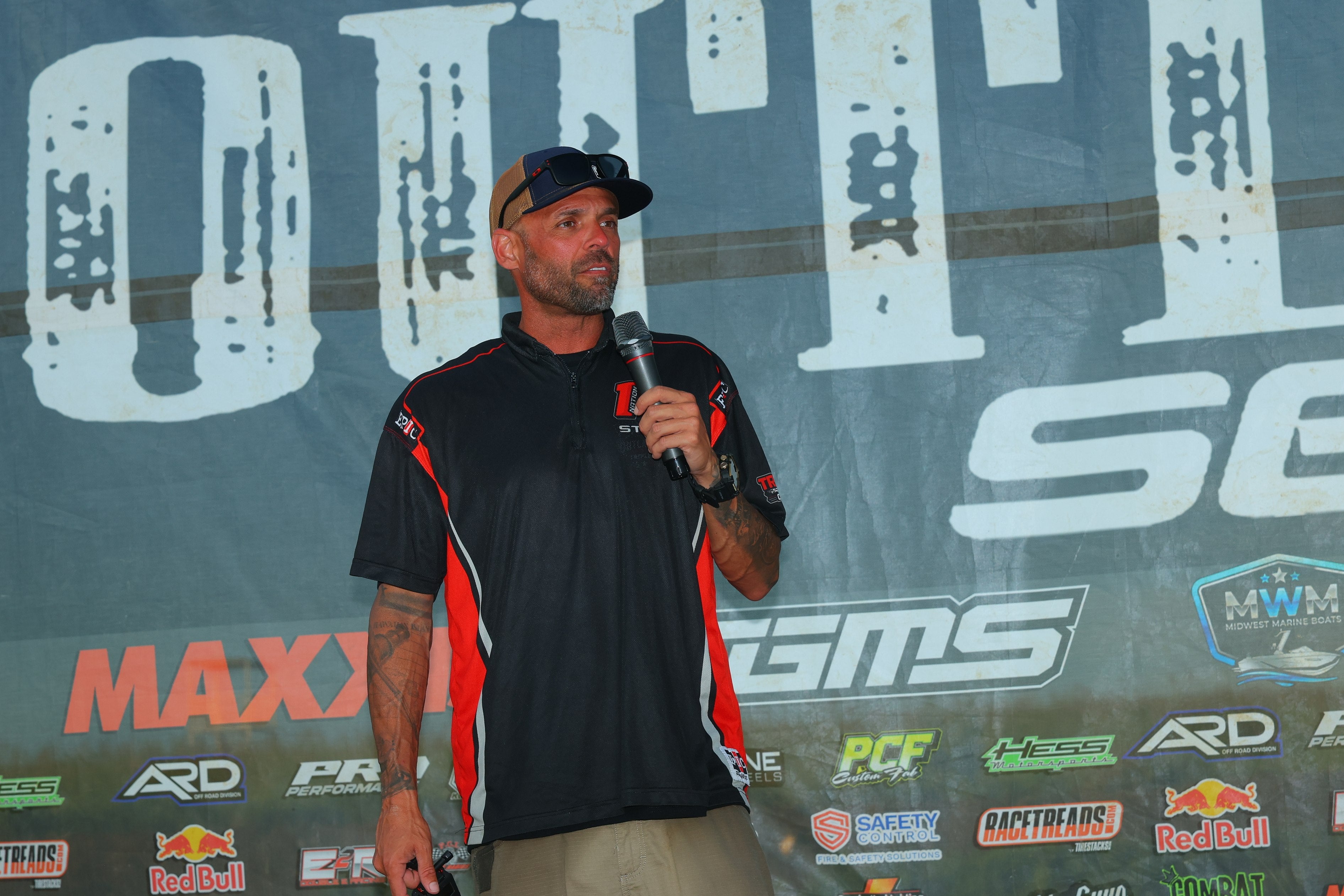 Outlaw Series announcer speaking on stage