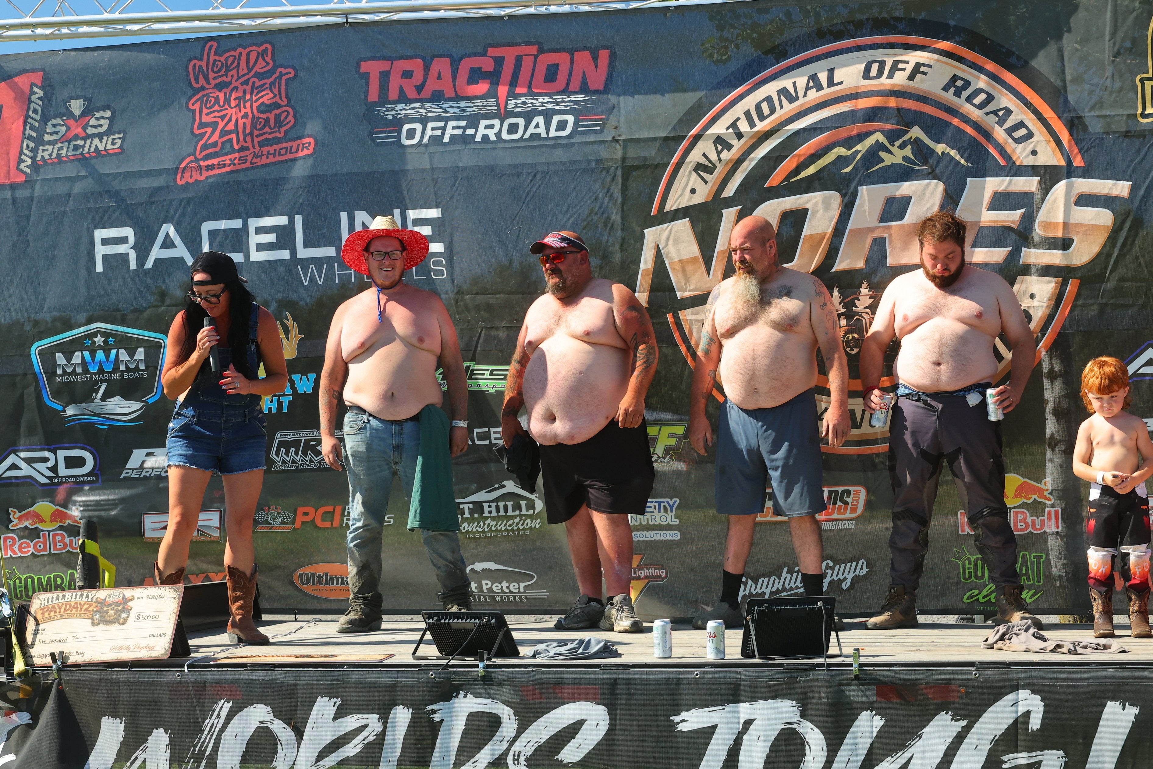 Hillbilly Pay Dayz competitors on the event stage