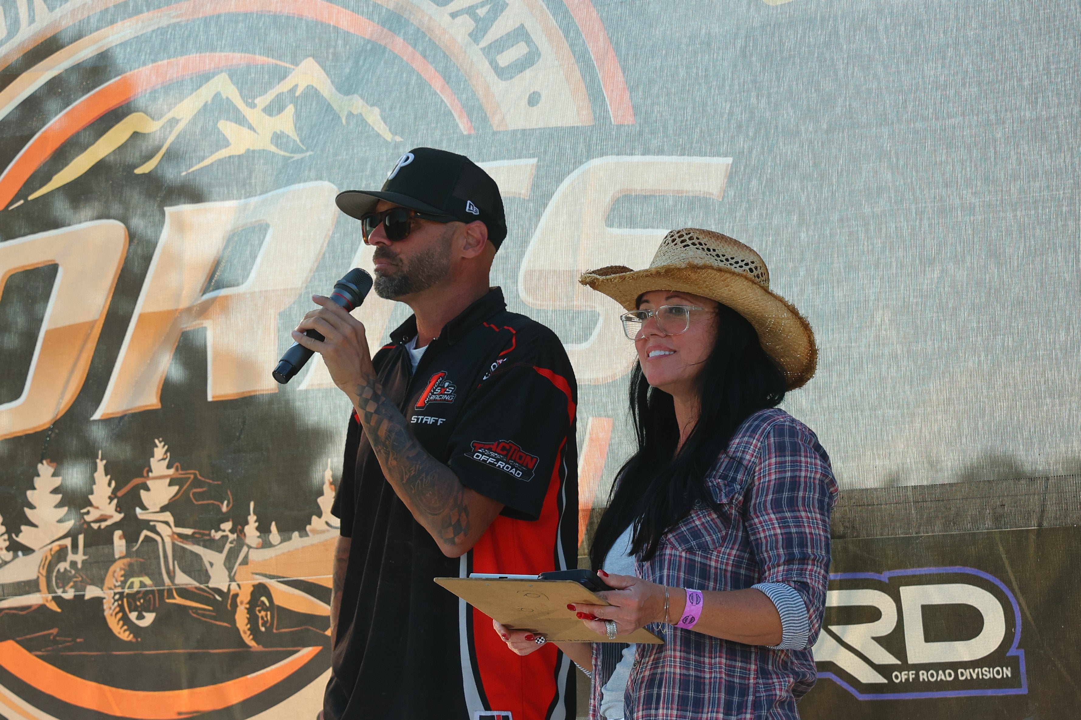Outlaw Series hosts speaking on stage